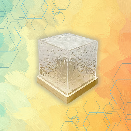 Clear glass cube on a colorful abstract background with geometric shapes